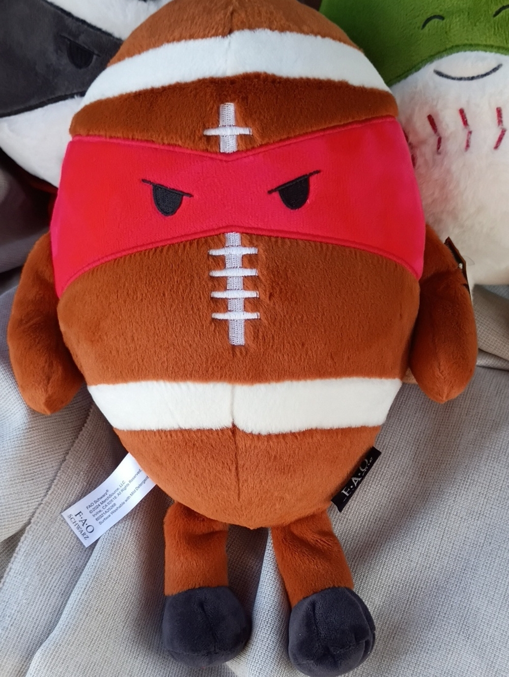 FAO Schwarz Brown Plush Football Character with Red Mask